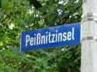 Uli below Road Sign.