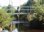 Bridge crossing the river at Chantemille #1 Island.