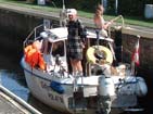 Sailing boat inside sluice.