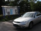 Notice board and car.
